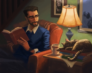 A man in a blue sweater is sitting in a large leather arm chair by the light of a lamp, looking over at a cat sleeping next to him.